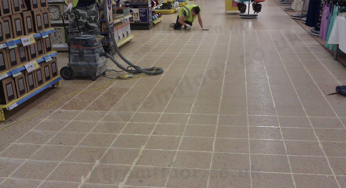 Joints between terrazzo tiles cut and filled in a supermarket